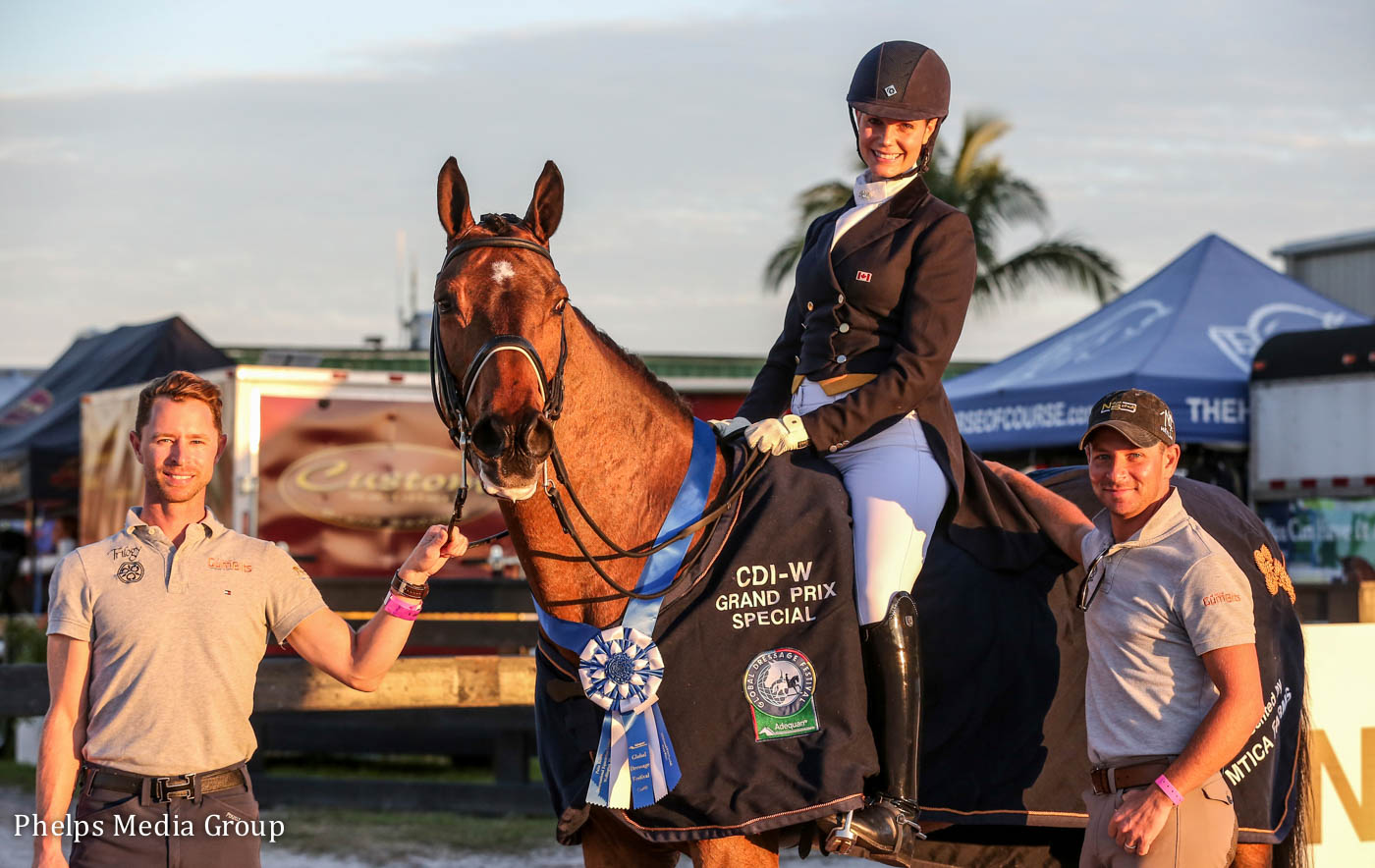 Nicholas Fyffe and David Marcus with their student, Leah Wilson Wilkins on Fabian JS, after winning the Grand Prix Special at the Lloyd Landkamer CDI-W.