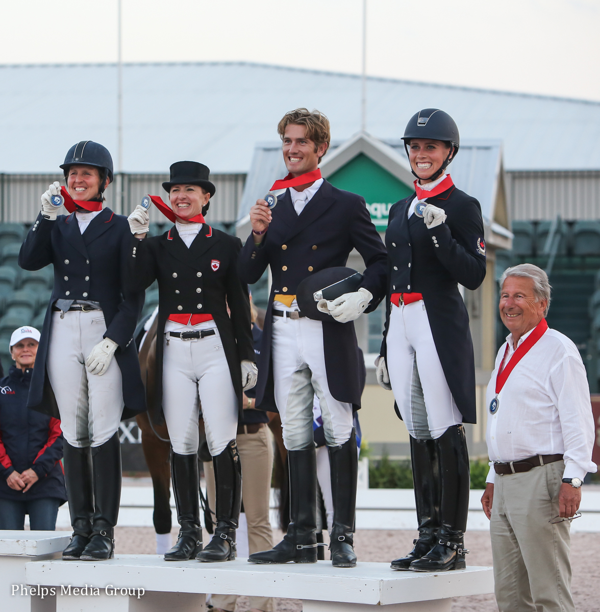 Canada Team 1 - Diane Creech, Belinda Trussell, Chris von Martels, Megan Lane and chef d'equipe Volker Moritz - show off their silver medals at the Stillpoint Farm Nations Cup CDIO3* in Wellington, Florida